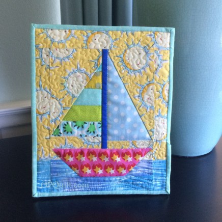Tiny Sailboat Quilt_front on frame