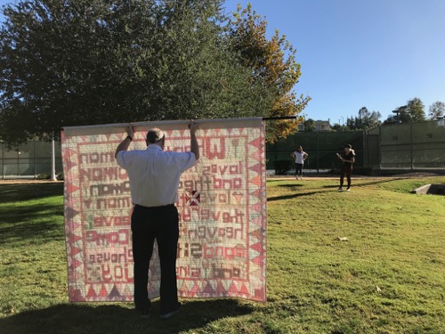 Sing for Joy_holding a quilt.jpg